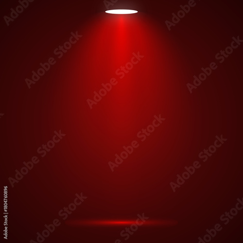 Red spotlight shining down creating a dramatic effect ideal for product presentations or stage backgrounds