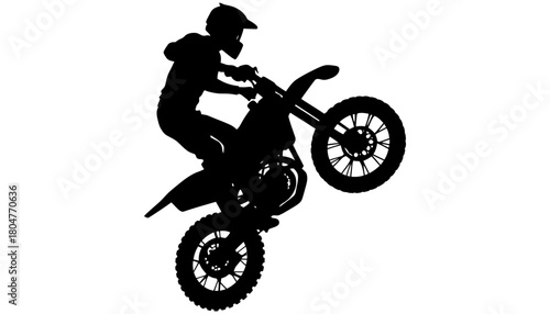 Silhouette motocross rider doing wheelie stunt bike adventure