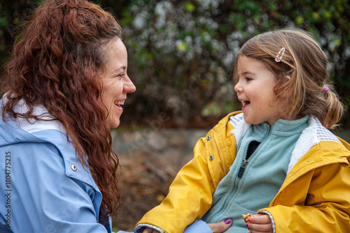 Happy Real People: Mother and Toddler in Rainy Weather.