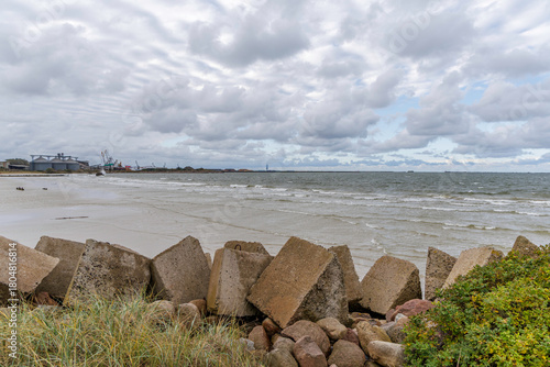 Fototapeta Naklejka Na Ścianę i Meble -  Concrete Breakwater Blocks on Sandy Baltic Sea Beach