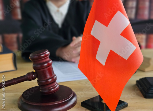 Fotografie Judge presiding over court session with Swiss flag on display in background conc