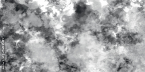 Soft, swirling grayscale clouds forming an abstract, misty backdrop. The blending tones of grey and white create a textured effect similar to smoke, fog, or ink washes, 