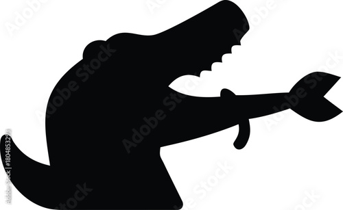 Black silhouette of a crocodile with a book on its snout