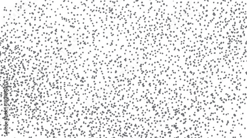A dense scattering of small irregular grey dots on a stark white background creating a textured pattern