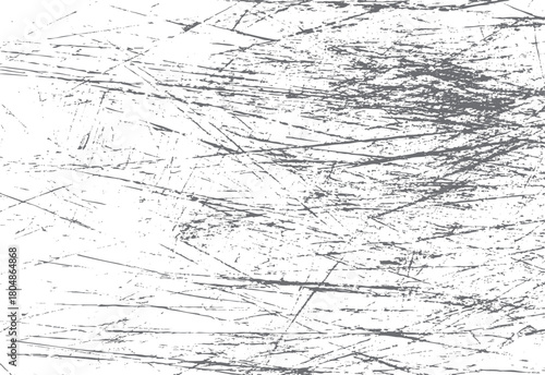 Abstract grey distressed grunge texture with random linear scratches and speckles on a white background