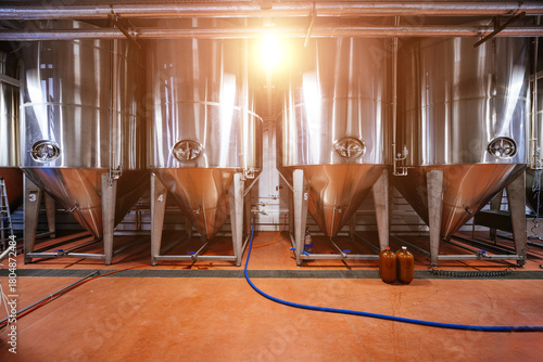 Stainless steel cylinders in private craft brewery or winery production line