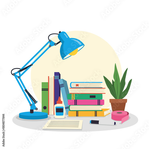 A bright desk setup with a blue lamp illuminating books, a plant, glue, and a tape measure.