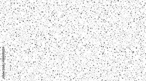 Seamless pattern of scattered grey dots of varying sizes on a white background abstract texture black