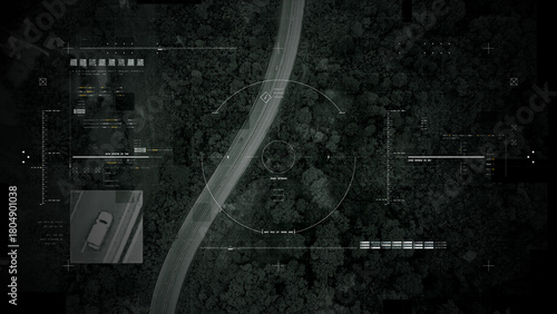 Aerial surveillance, military reconnaissance view of a complex highway interchange with HUD targeting graphics, creating a cinematic spy-drone atmosphere and intelligence-operation mood
