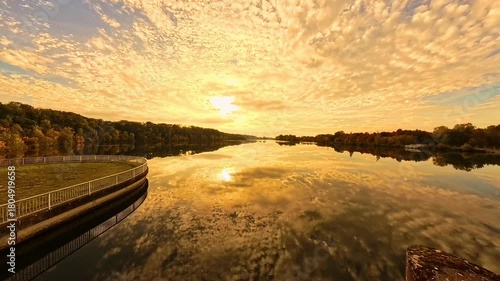 4K Timelapse video with moving clouds and reflections near sunset or sundowner at Zulling, Landau, river Isar, Dingolfing, Bavaria, Germany