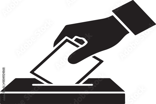 Hand dropping ballot into box voting election