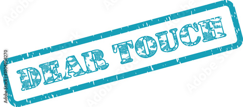 A distressed teal rubber stamp impression reading Dear Touch on a smooth clean surface