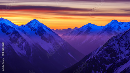 Snowy mountain peaks glow at sunset in the austrian alps