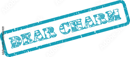 Distressed teal rectangular stamp impression displaying the words Dear Charm with rustic appeal