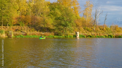 kayak on a river in a park in autumn