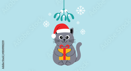 Cute gray cat wearing a Santa hat and holding a gift under mistletoe.