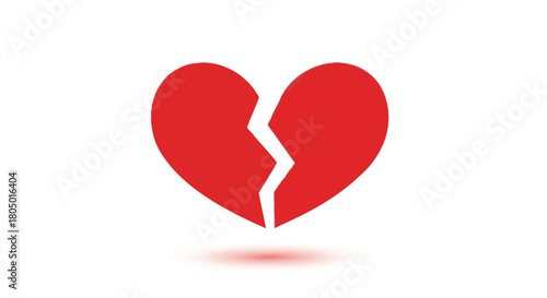 A simple red broken heart symbol with a white crack down the middle casting a soft shadow