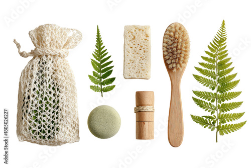 Eco-friendly toiletries arranged on a dark background, featuring a mesh bag, soap bar, brush, and leaves