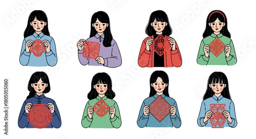 Chinese girls holding paper cuttings for Lunar New Year