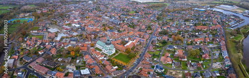 An aerial panorama view above the old town of the city Haren (Ems), 49733 on an early summer morning in Germany