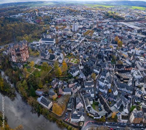 An aerial panorama view above the old town of the city Limburg on an early summer morning in Germany