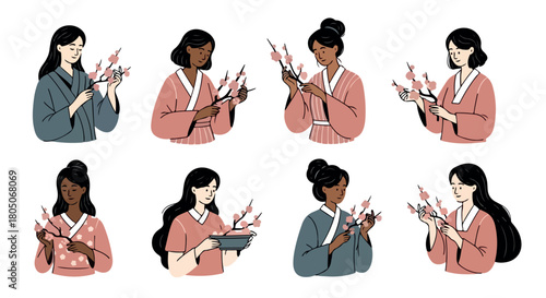 Women holding cherry blossoms in traditional kimonos