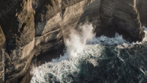 Dramatic Ocean Waves Crashing Against Rugged Coastal Cliffs.
