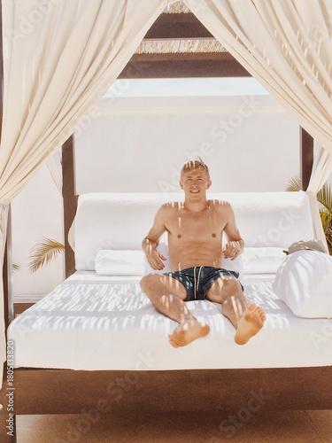 Fit Blonde Male Relaxing Outside on Vacation