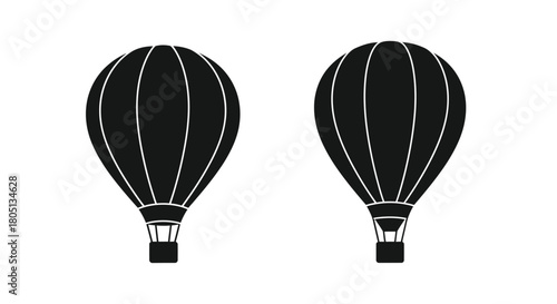 Two black silhouette hot air balloons against a plain white background