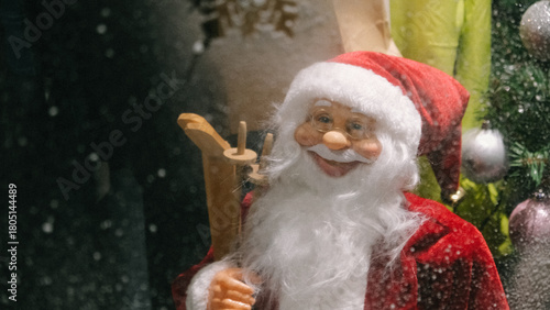 Photos Santa Claus is standing in the shop window. santa claus doll