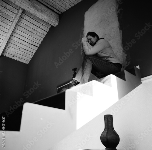 Winter in Tbilisi, a woman sitting on a staircase. Georgia - March 2025.