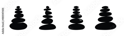 Four balanced black stone stacks on a clean white background