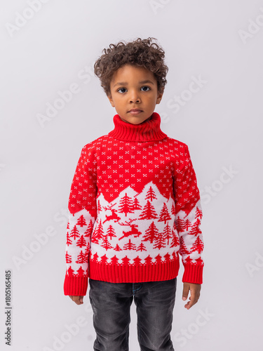 Cuadro en lienzo little mulatto boy in a New Year's sweater on a white background in a studio