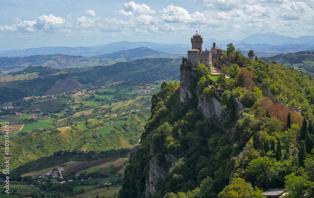 Fototapeta premium View of the Seconda Torre (Cesta) fortress and walls atop the dramatic, rocky ridge of Monte Titano.