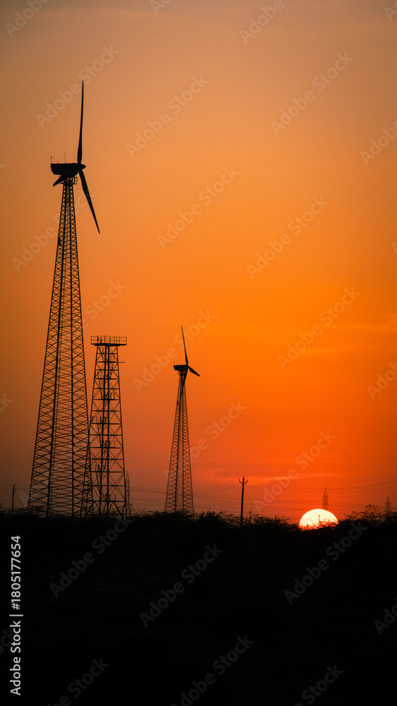 Obraz premium wind turbine sunset
