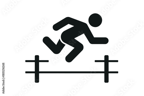 Silhouette of a runner jumping over a hurdle in a track and field competition.