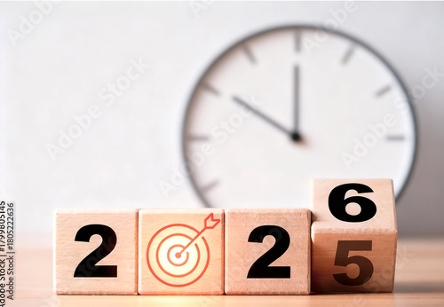 Imagem criativa e moderna de blocos de madeira alinhados, representando a virada do ano de 2025 para 2026, com números destacados, relógio e alvo estilizados, fundo claro e toque elegante