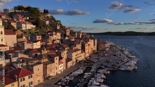 Amazing Flyby at Sunset over Sibenik, Croatia. St. James Cathedral, a UNESCO World Heritage, terracotta rooftops.