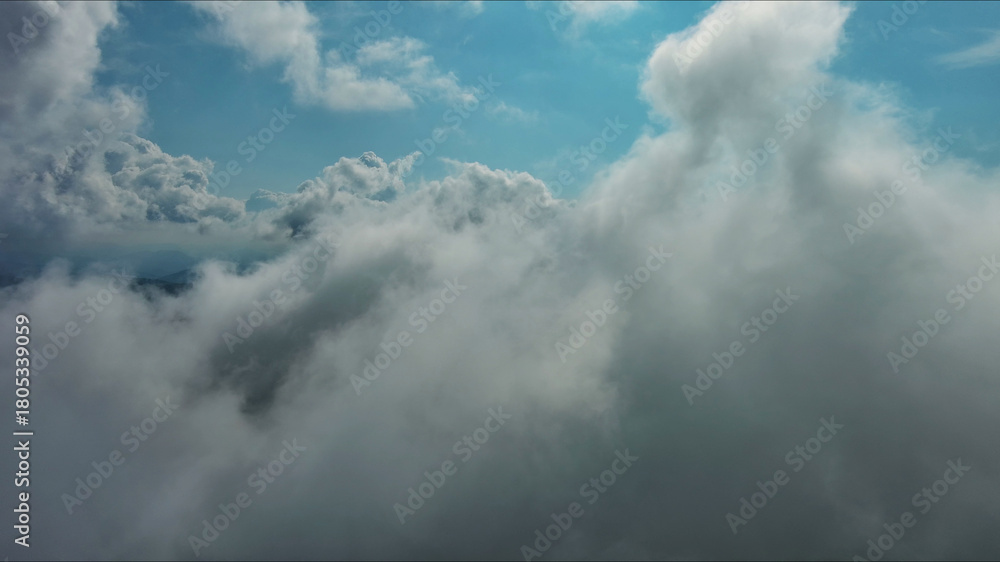 Obraz premium Clouds and blue sky, flying in clouds