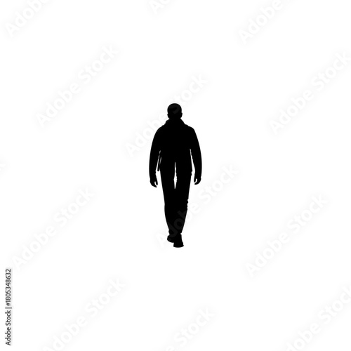 Powerful silhouette of a person walking forward with purpose on a light backdrop, conveying determination
