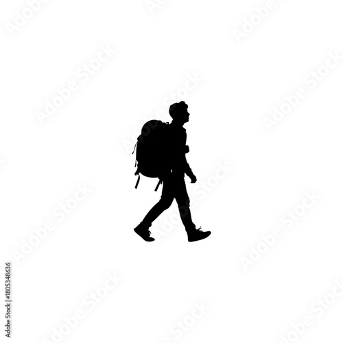 Silhouette of a young traveler hiking with a backpack, exploring the great outdoors with determination