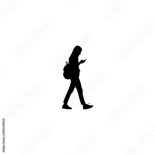 Silhouette of a young woman on the go texting on her phone with backpack for urban lifestyle campaigns