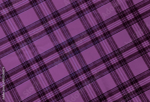texture of  violet purple pink black diagonal checkered fabric pattern background. traditional tablecloth checkered as backdrop. top view. Merry christmas happy New year holiday Holiday event