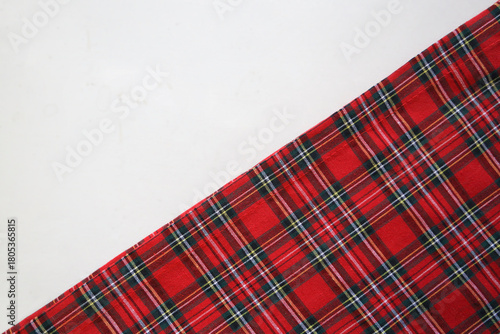 texture of red green black diagonal checkered fabric pattern background. traditional tablecloth checkered as backdrop Top view christmas happy New year holiday Holiday event Triangle Isolated on white