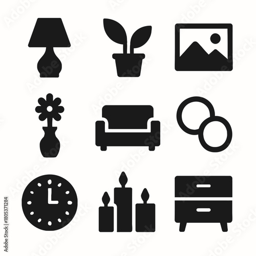 Black silhouette icons of home decor items including lamp, plant, vase, sofa, candles, clock, and cabinet