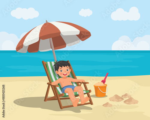 Little boy sitting on beach chair relaxing under umbrella on the beach at summer vacation