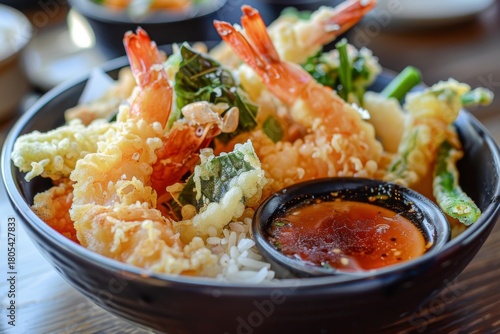 Delicious shrimp tempura bowl with rice and sauce