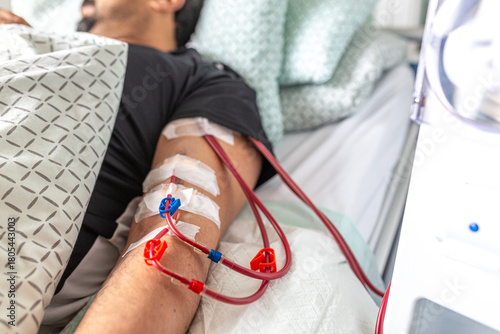 Germany, Bavaria, Munich, Portrait photograph of a man in the dialysis unit of a hospital