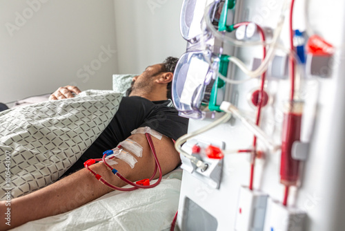 Germany, Bavaria, Munich, Portrait photograph of a man in the dialysis unit of a hospital