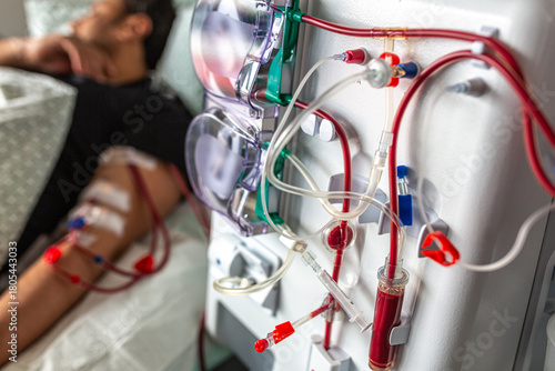 Germany, Bavaria, Munich, Portrait photograph of a man in the dialysis unit of a hospital